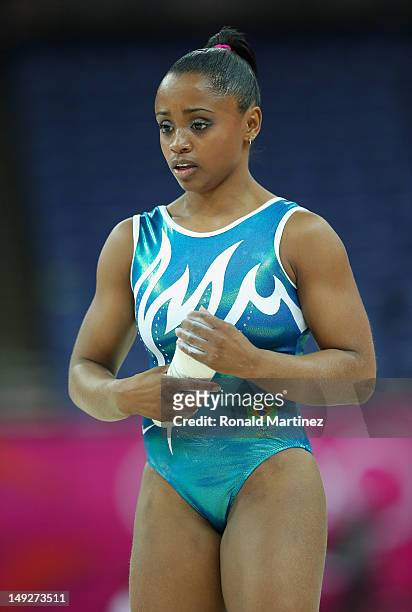 Daiane dos Santos of Brazil chalks her hands during training sessions for artistic gymnastics ahead of the 2012 Olympic Games at Greenwich Training...