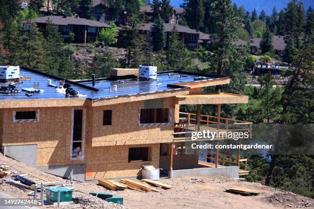 ultra modern residential angles overlooking water and pine trees - terrace british columbia stock pictures, royalty-free photos & images