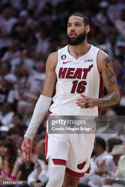 Caleb Martin of the Miami Heat reacts to a three point basket against the Boston Celtics during the first quarter in game four of the Eastern...