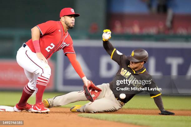 Juan Soto of the San Diego Padres beats the tag throw to Luis Garcia of the Washington Nationals to steal second base in the fifth inning during a...