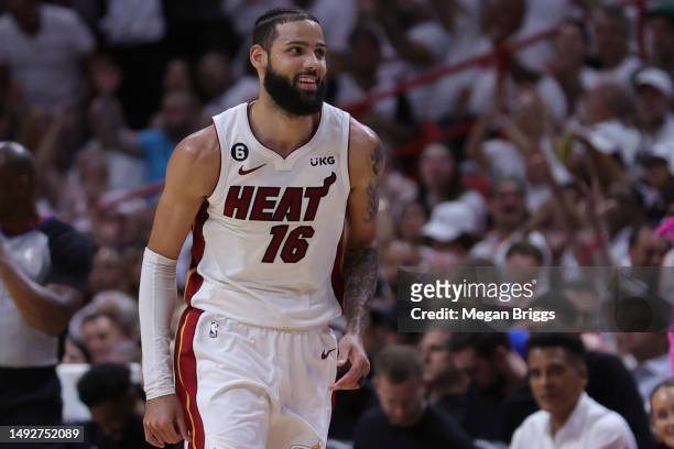 Caleb Martin of the Miami Heat reacts to a three point basket against the Boston Celtics during the second quarter in game four of the Eastern...