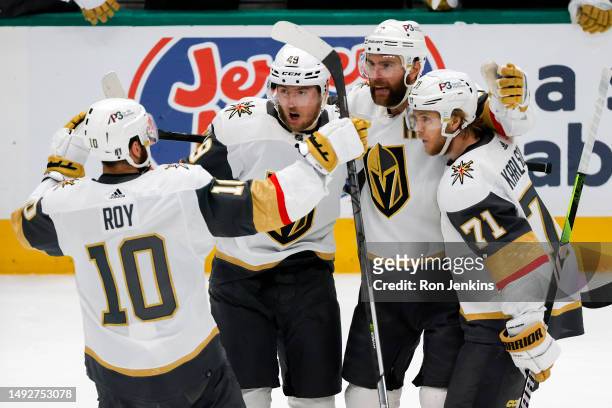 Alex Pietrangelo of the Vegas Golden Knights is congratulated by his teammates after scoring a goal against the Dallas Stars during the second period...