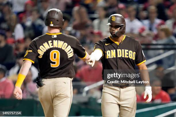 Jake Cronenworth of the San Diego Padres celebrates hitting a two run home run in the seventh inning with Xander Bogaerts during a baseball game...