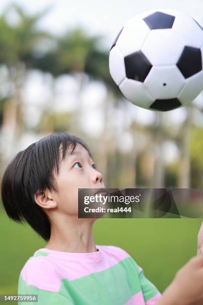 boy practicing soccer skill - soccer training grounds stock pictures, royalty-free photos & images