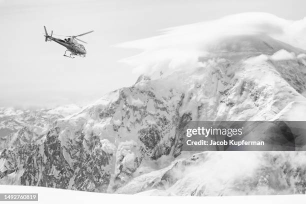 mount foraker in alaska, as seen from denali, with helicopter in foreground - フォーレイカー山 ストックフォトと画像