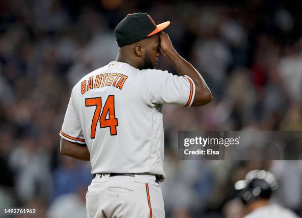 Felix Bautista of the Baltimore Orioles reacts to giving up a solo home run to Aaron Judge of the New York Yankees to tie the game in the ninth...