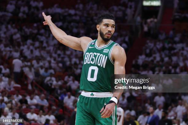 Jayson Tatum of the Boston Celtics reacts against the Miami Heat during the fourth quarter in game four of the Eastern Conference Finals at Kaseya...