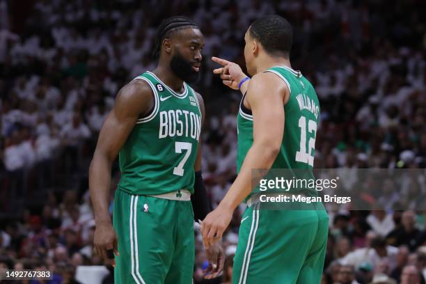 Jaylen Brown and Grant Williams of the Boston Celtics interact against the Miami Heat during the fourth quarter in game four of the Eastern...