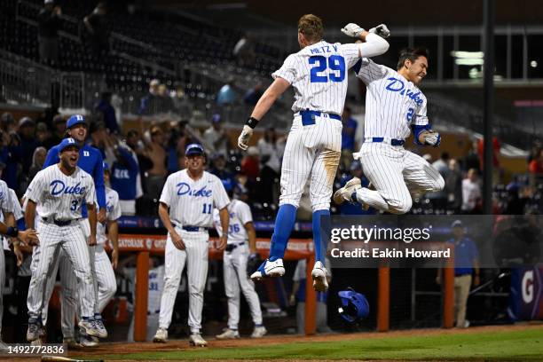 Chad Knight celebrates with MJ Metz of the Duke Blue Devils after his home run in the ninth inning during the ACC Baseball Championship at Durham...