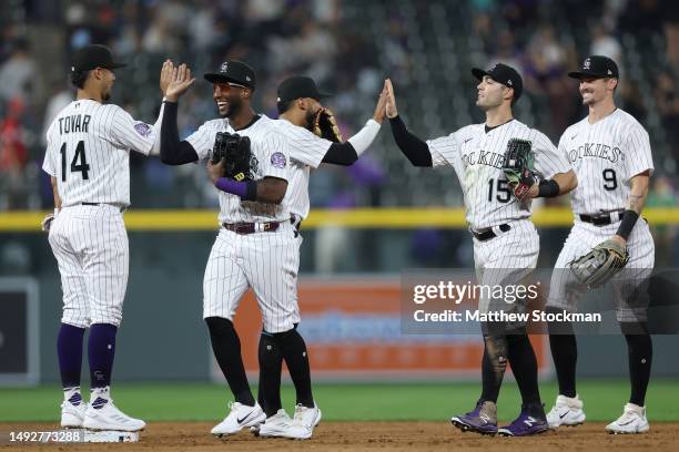 Ezequiel Tovar, Jurickson Profar, Harold Castro, Randal Grichuk and Brenton Doyle of the Colorado Rockies celebrates their win against the Miami...