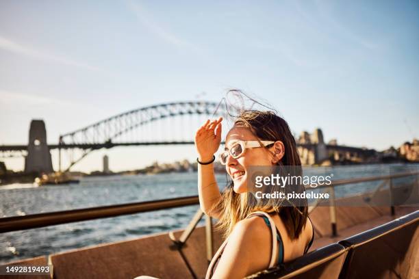 exploring sydney and australia - person looking at phone while smiling australia stock pictures, royalty-free photos & images
