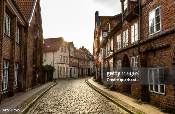 small alley in lüneburg in germany - lüneburg stock pictures, royalty-free photos & images