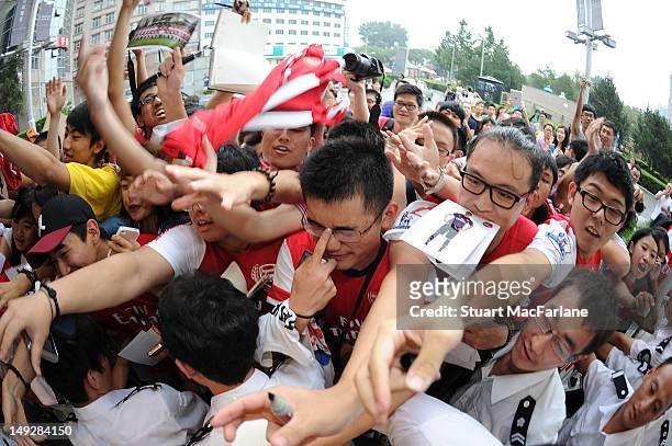 Arsenal fans wait for the players after a Nike event in Beijing during their pre-season Asian Tour in China on July 26 2012 in Beijing, China.