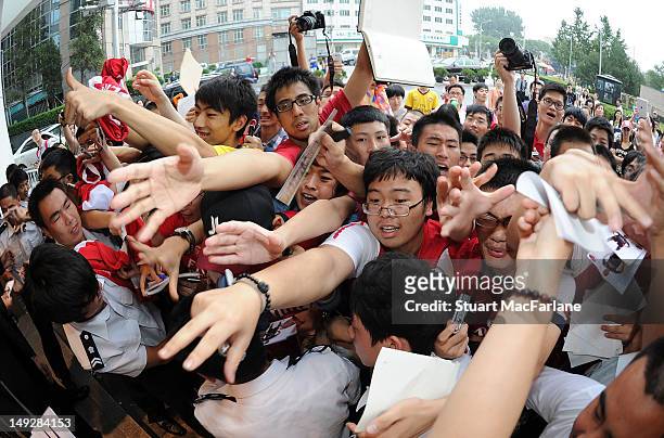 Arsenal fans wait for the players after a Nike event in Beijing during their pre-season Asian Tour in China on July 26 2012 in Beijing, China.