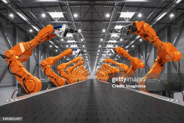 saldatura robotizzata e bracci robotici nel magazzino di distribuzione intelligente - robotica foto e immagini stock