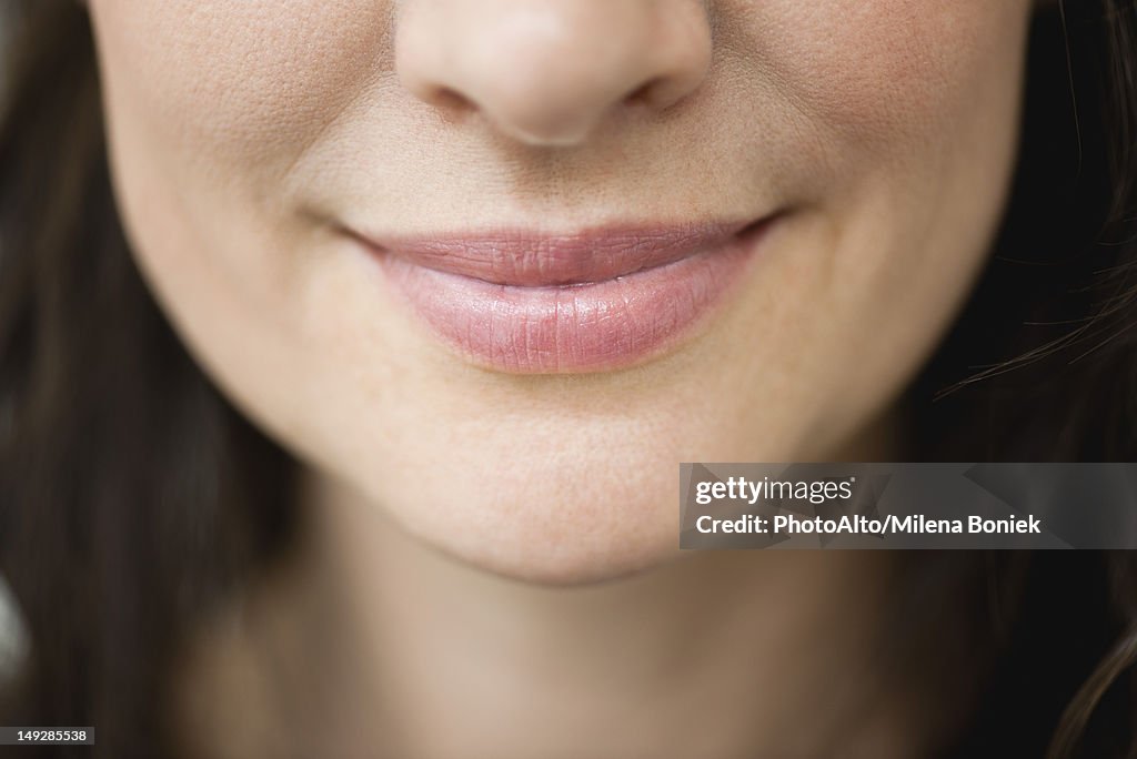 Close-up of woman's smiling lips