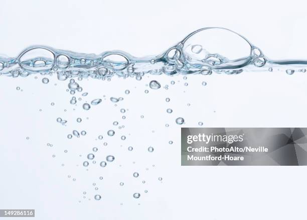 bubbles on surface of water - water bubbles stock pictures, royalty-free photos & images