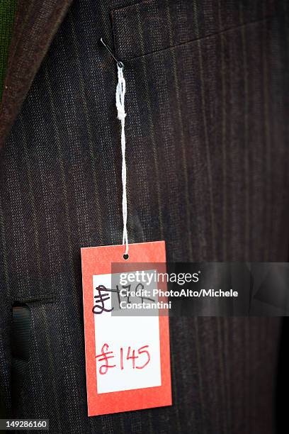 sale tag on clothing - clothing tag stock pictures, royalty-free photos & images