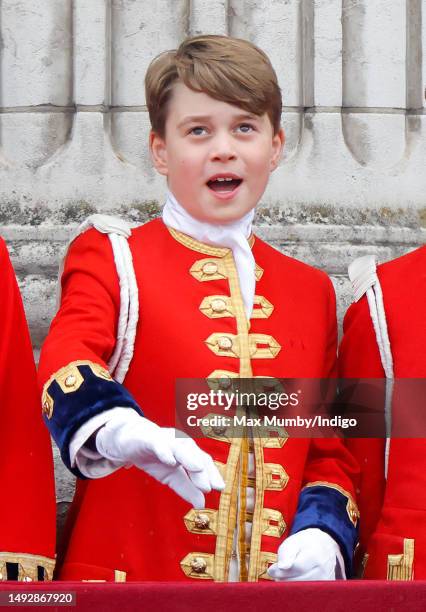 Prince George of Wales watches an RAF flypast from the balcony of Buckingham Palace following the Coronation of King Charles III & Queen Camilla at...