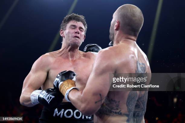 Tom Bellchambers punches Cameron Mooney during their Heavyweight bout at Margaret Court Arena on May 24, 2023 in Melbourne, Australia.
