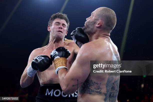 Cameron Mooney punches Tom Bellchambers during their Heavyweight bout at Margaret Court Arena on May 24, 2023 in Melbourne, Australia.