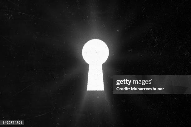 keyhole. white light breaks through the keyhole symbol of idea or hope. background illustration. - keyhole stock illustrations