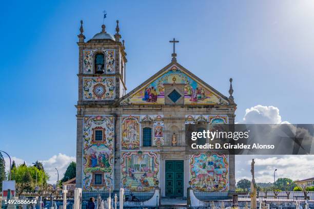 view at the painted decoration facade church our lady of amparo in valega ,portugal - azulejos foto e immagini stock