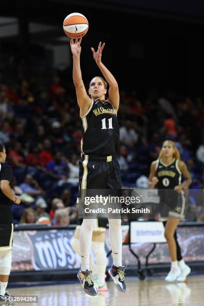 Elena Delle Donne of the Washington Mystics shoots the ball against the Connecticut Sun at Entertainment & Sports Arena on May 23, 2023 in...