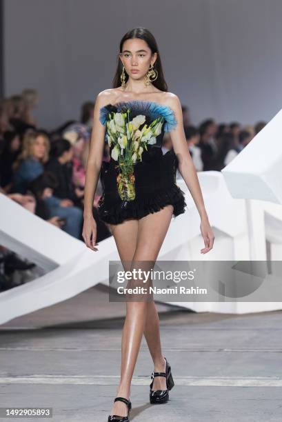 Model walks the runway in a design by Rube Pedder during the Next Gen - Runway show during Afterpay Australian Fashion Week 2023 at Carriageworks on...