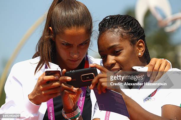 Judokas Giulia Quintavalle and Edwige Gwend of Italy arrive during the Olympic Village arrivals ahead of the London 2012 Olympics at the Olympic Park...