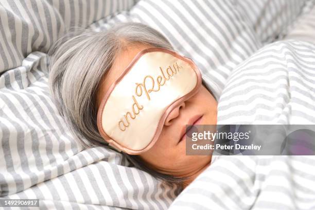 relax, sleeping mask - elderly woman stock pictures, royalty-free photos & images