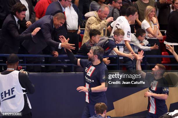 Luka Karabatic of PSG Handball celebrates the victory with Daniel Narcisse following the EHF Champions League match between Paris Saint Germain...