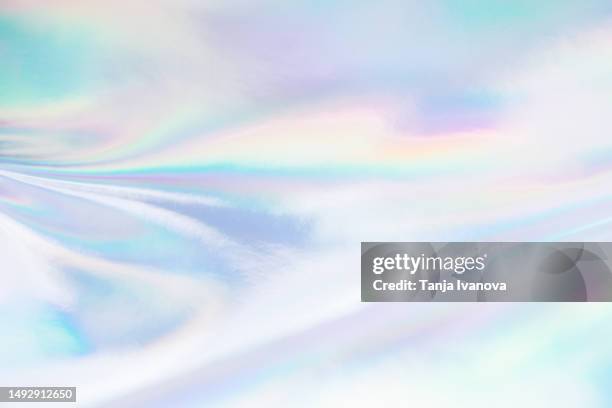 abstract neon holographic background, with shimmering, iridescent effect with a rainbow of colors show the alternate reality of the metaverse. meta and web backgrounds and textures. - holograma imagens e fotografias de stock