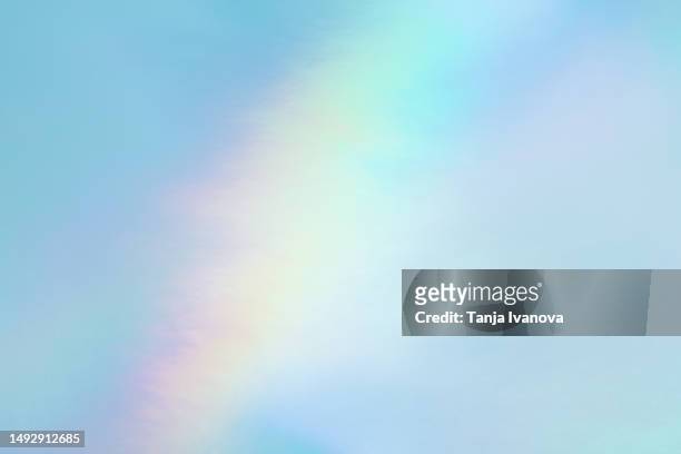 abstract neon holographic background, with shimmering, iridescent effect with a rainbow of colors show the alternate reality of the metaverse. meta and web backgrounds and textures. - iridescent stockfoto's en -beelden