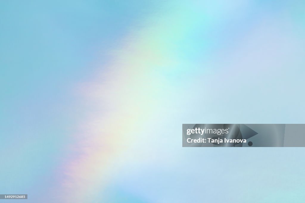 Abstract Neon holographic background, with shimmering, iridescent effect with a rainbow of colors show the alternate reality of the metaverse. Meta and Web backgrounds and textures.