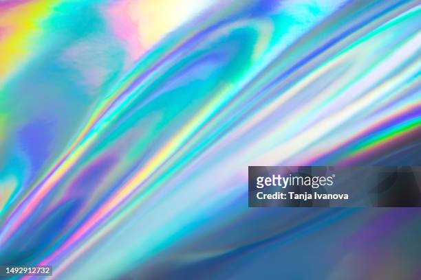 abstract neon holographic background, with shimmering, iridescent effect with a rainbow of colors show the alternate reality of the metaverse. meta and web backgrounds and textures. - hologramm stock-fotos und bilder