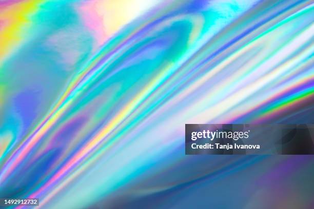 abstract neon holographic background, with shimmering, iridescent effect with a rainbow of colors show the alternate reality of the metaverse. meta and web backgrounds and textures. - holograma imagens e fotografias de stock