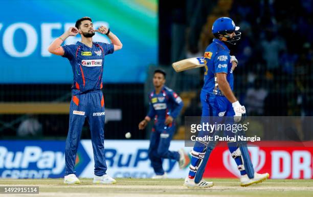 Naveen Ul Haq of Lucknow Super Giants celebrates after taking the wicket of Rohit Sharma of Mumbai Indians during the IPL Eliminator match between...