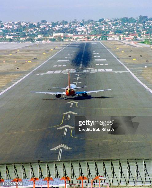 Jetliner takes off from on Main Runway at San Diego Lindbergh Field, January 20, 1995 in San Diego, California.