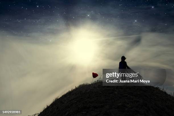 child against the light, imitates the little prince, from the novel by antoine de saint-exupéry. - world literature stock pictures, royalty-free photos & images