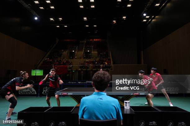 Wang Chuqin and Sun Yingsha of China compete in the Mixed Doubles third round match against Robert Gardos and Sofia Polcanova of Austria on day 4 of...