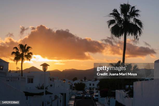 sunset in the town of puerto del carmen. lanzarote. canary islands - puerto del carmen stock pictures, royalty-free photos & images