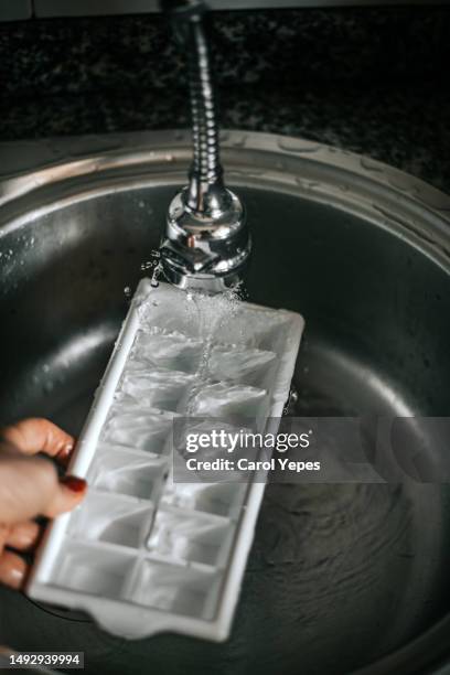 filling ice cube bucket - running water isolated stock pictures, royalty-free photos & images