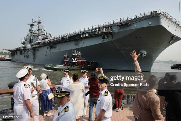 Service men and women and invited guests watch from the the Intrepid Sea, Air & Space Museum as the USS Wasp, an amphibious assault ship from...