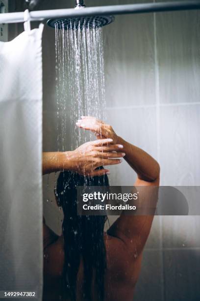 woman in the hotel room having a shower - human scalp stock pictures, royalty-free photos & images