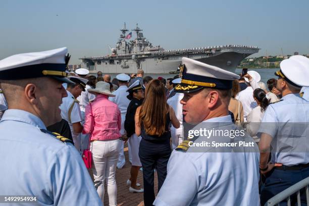 Service men and women watch from the Intrepid Sea, Air & Space Museum as ships and planes arrive into New York Harbor on Wednesday during the start...