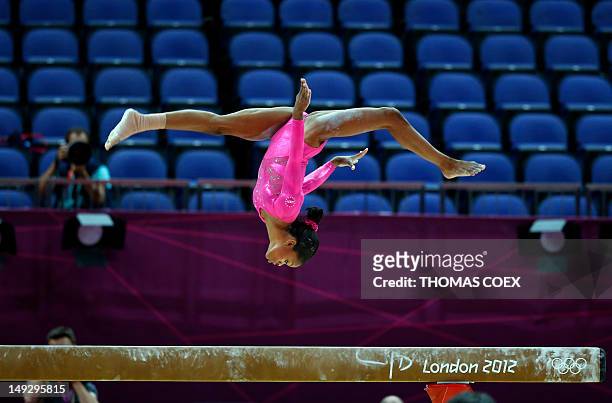 Gymnast Gabrielle Douglas takes part in a training session at 02 North Greenwich Arena in London on July 26, 2012 on the eve of the start of the...