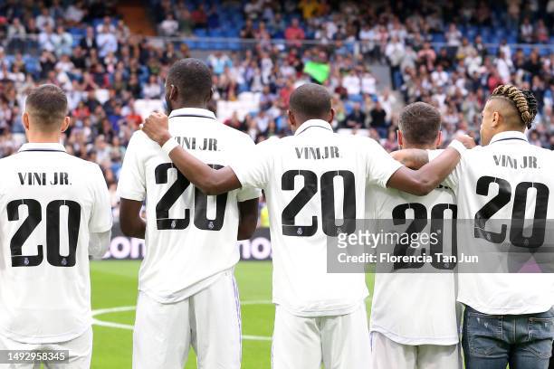 Players of Real Madrid wear a jersey in support of Vinicius Junior of Real Madrid prior to the LaLiga Santander match between Real Madrid CF and Rayo...