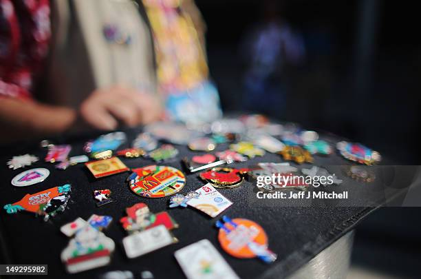 Trader displays his pins ahead of the London 2012 Olympics at the Olympic Park on July 26, 2012 in London, England.