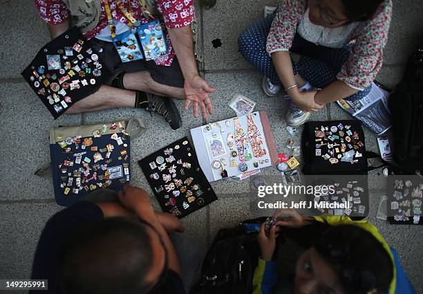 Trader displays his pins ahead of the London 2012 Olympics at the Olympic Park on July 26, 2012 in London, England.